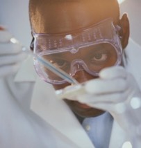 Pharmaceutical worker wearing goggles